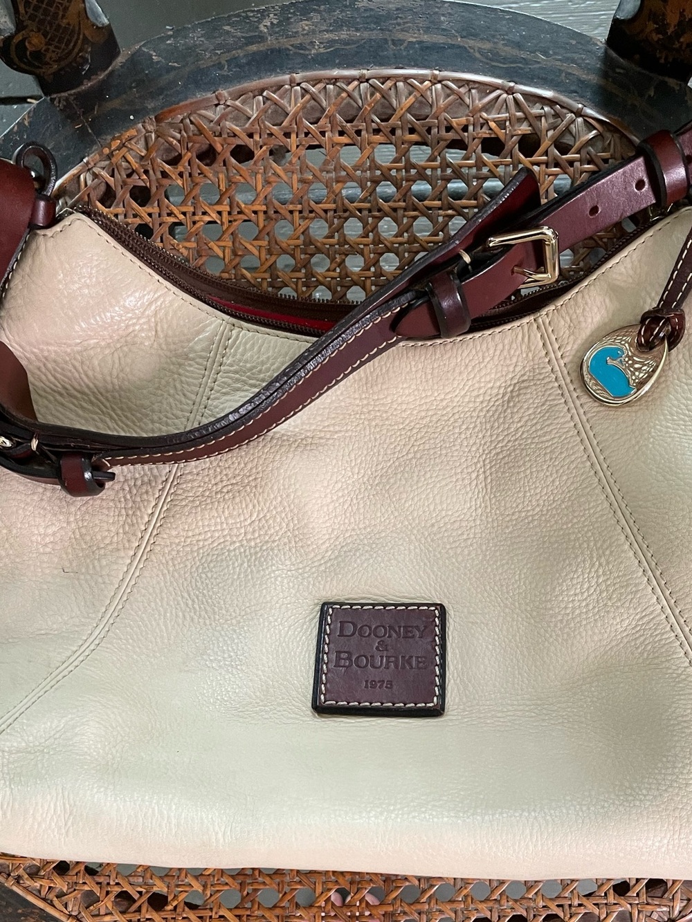 Dooney & Bourke Cream Leather Shoulder Bag with Brown Trim and Gold Accent